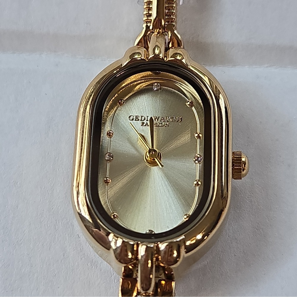 New Gedi Goldtone Petite Womens Bracelet Watch. Crystal Accents,Oval,Quartz.